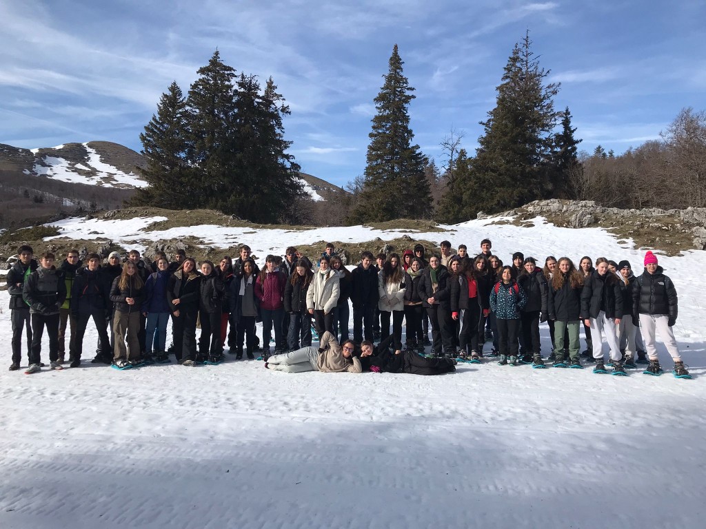Group photo of students in the snow