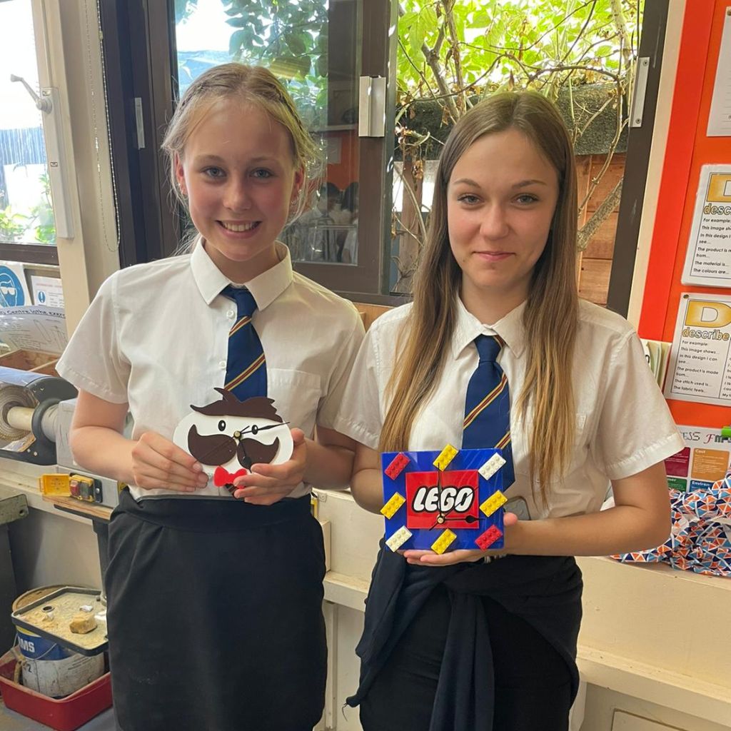 Yr9 DT students with their finished clock creations