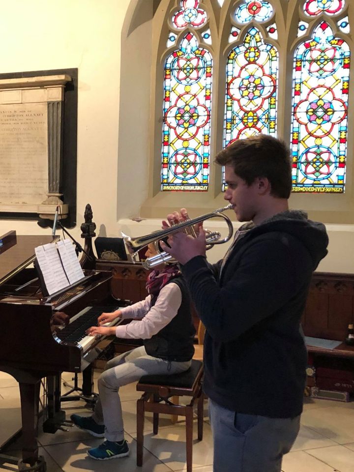 Students playing inside the church