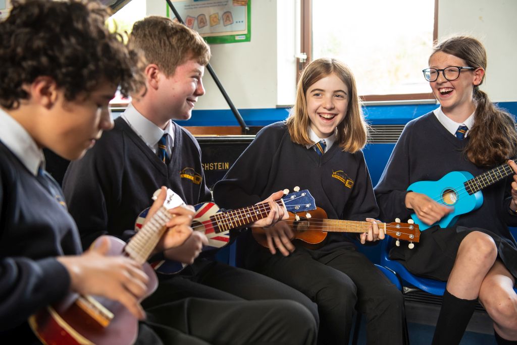 Students playing ukuleles